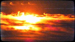 The same sunset on an old television: scan lines, a curved frame and a little static.